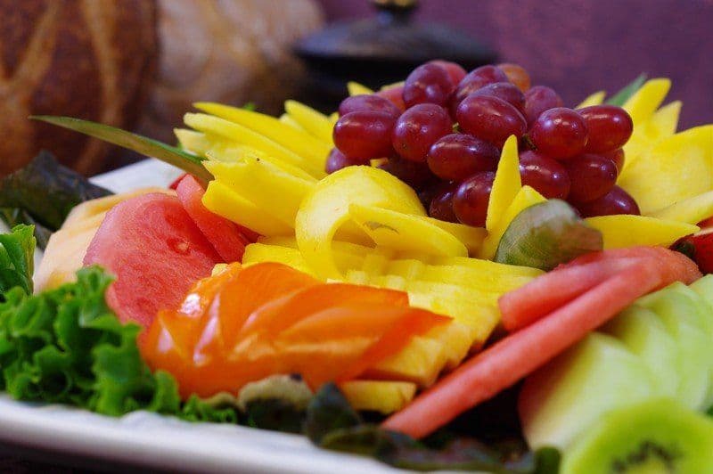 Sliced fresh seasonal fruit platter arranged by the chef