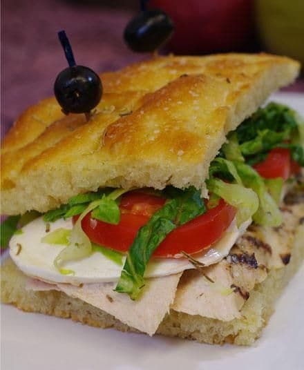 Gourmet sandwich on homemade focaccia for a corporate lunch platter