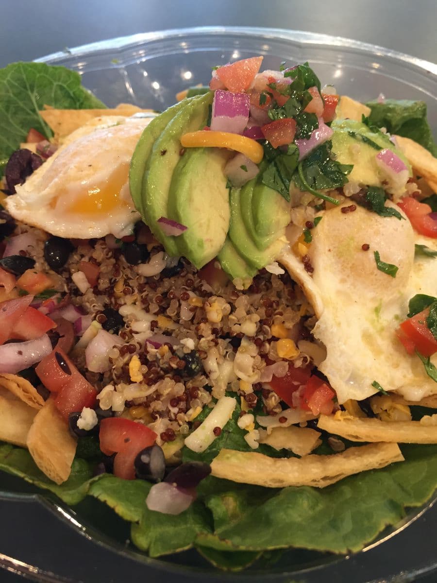 Quinoa bowl with avocado and egg, a healthy individual lunch option