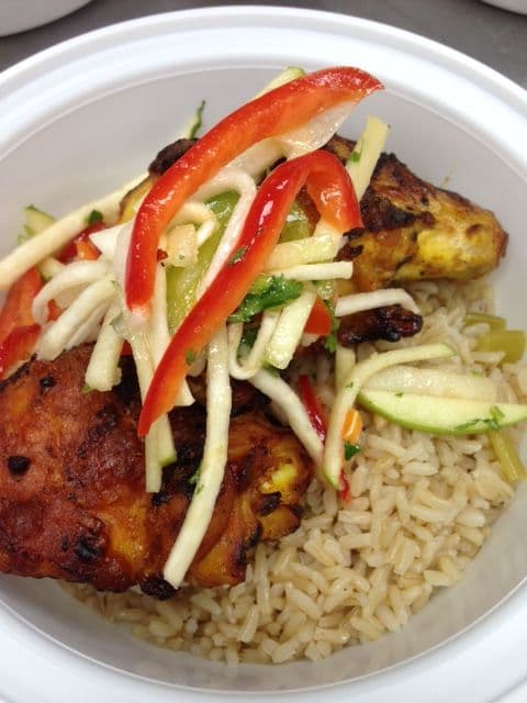 Tandoori chicken with pickled vegetables over rice
